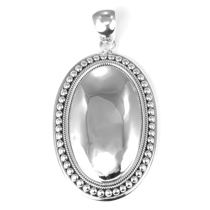Sterling silver mirror dome pendant.