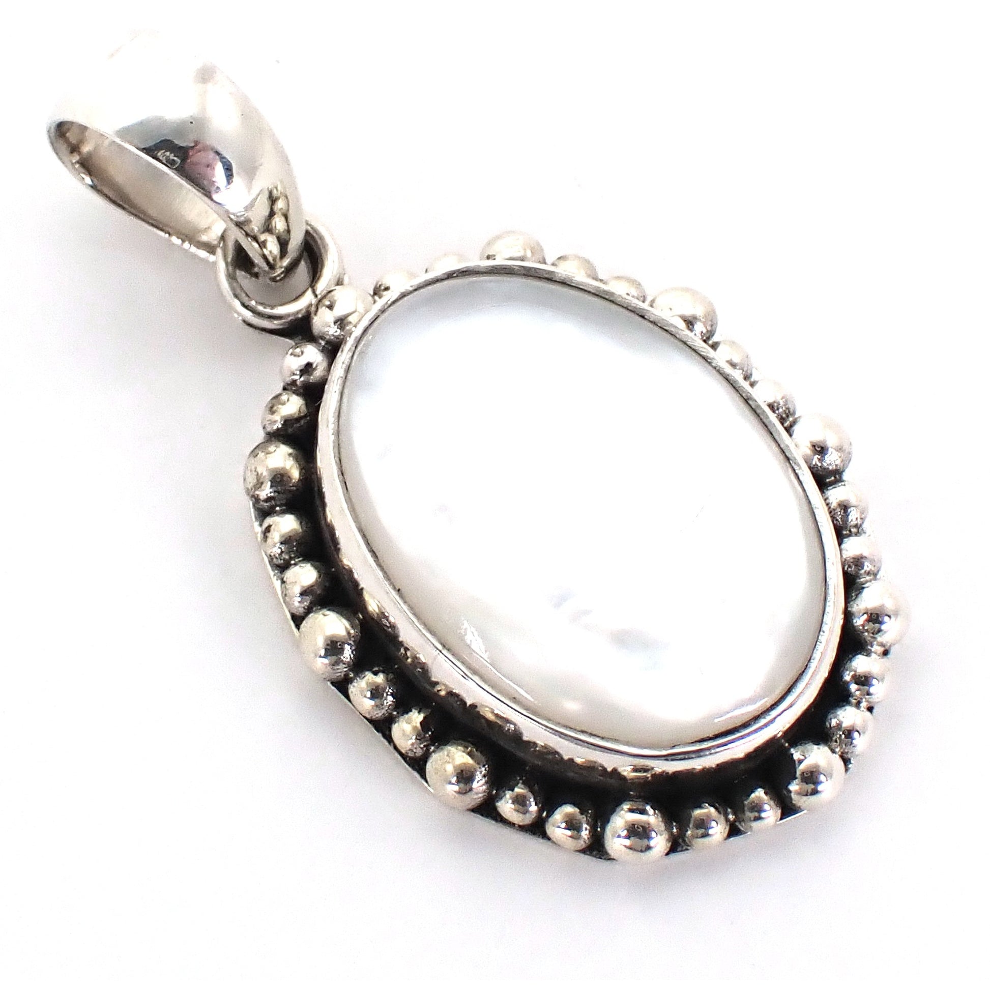 Sterling silver and oval mother of pearl pendant.