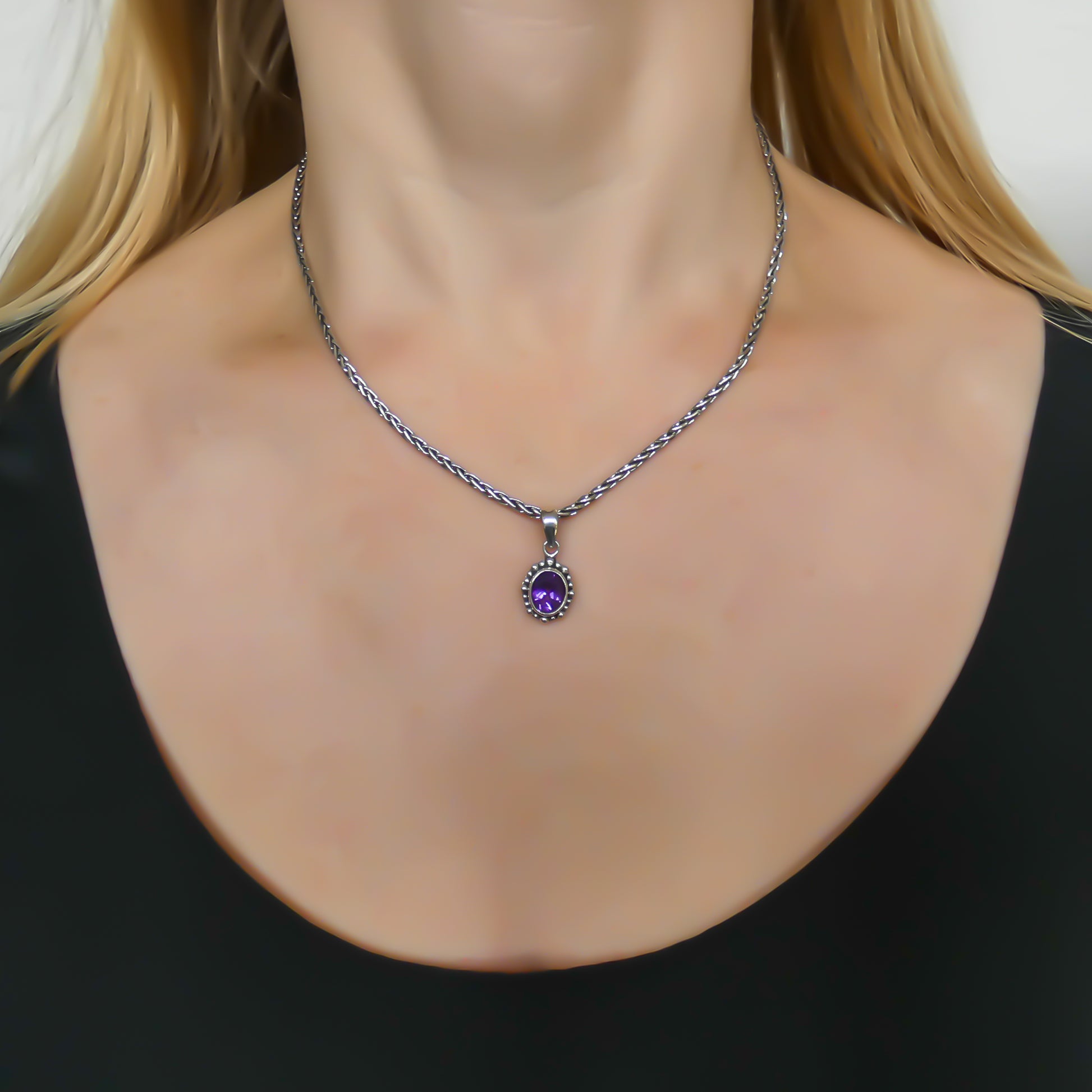 Sterling silver and oval amethyst pendant. 