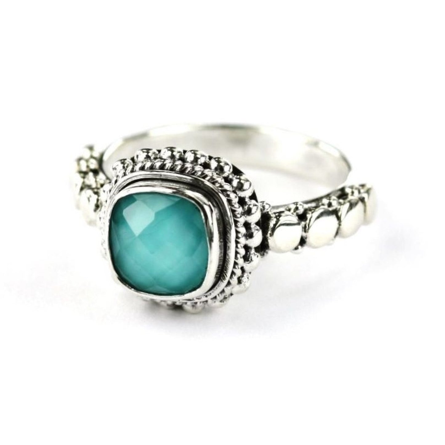 Silver ring with turquoise doublet gemstone.