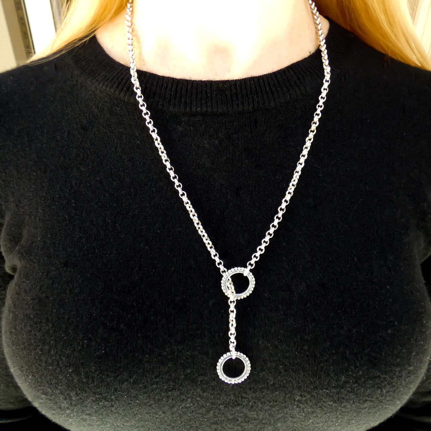 Lariat style sterling silver necklace.