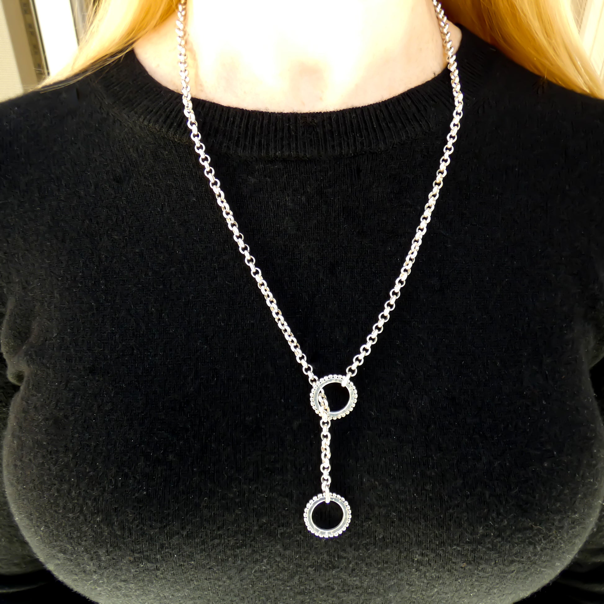 Lariat style sterling silver necklace.