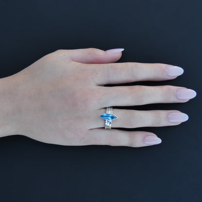 Sterling silver ring set with Swiss blue topaz marquis cut gemstone.