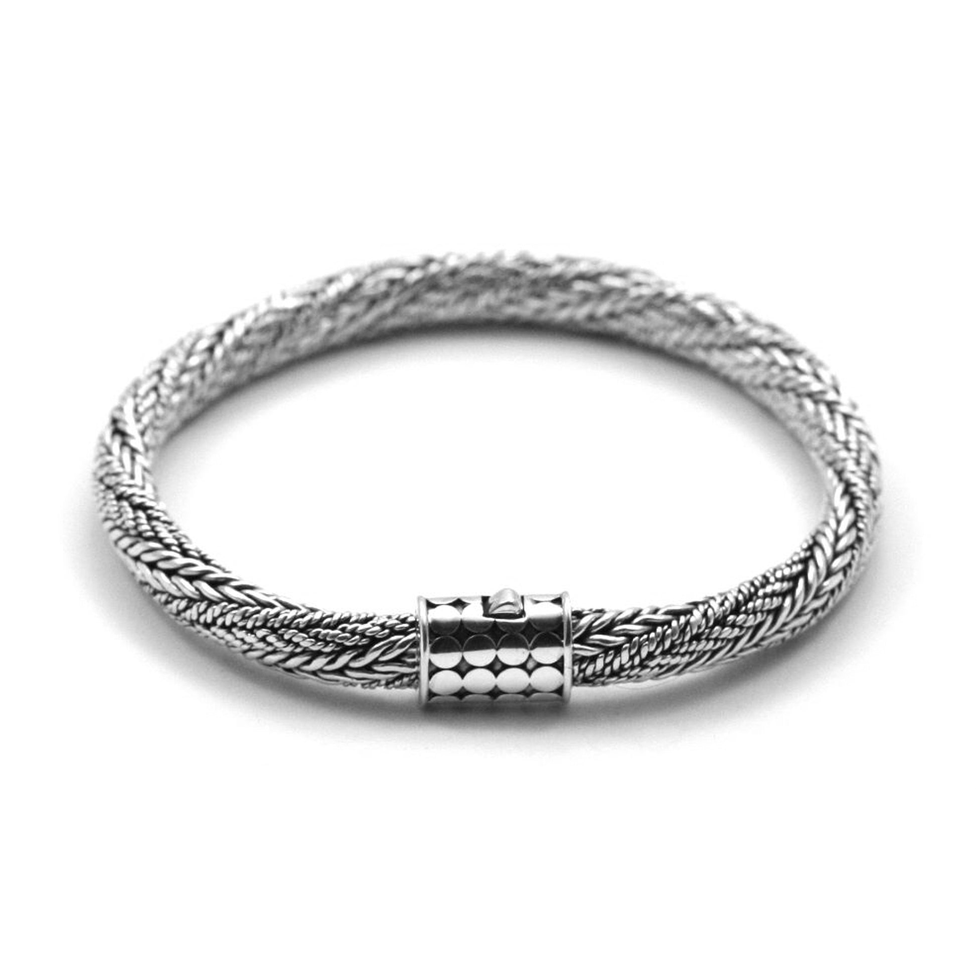 Twisted multi-textured silver chain bracelet with a decorated barrel clasp.