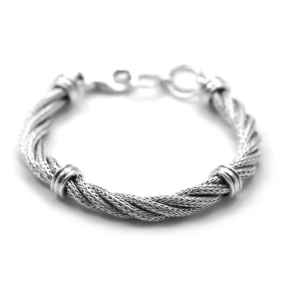 Silver bracelet made of spiral twisted silver herringbone chain with four high polish stations.