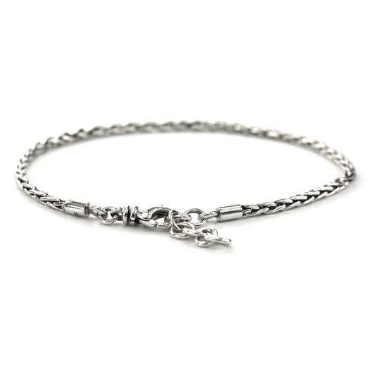 Silver chain bracelet with a wheat design and a lobster clasp.