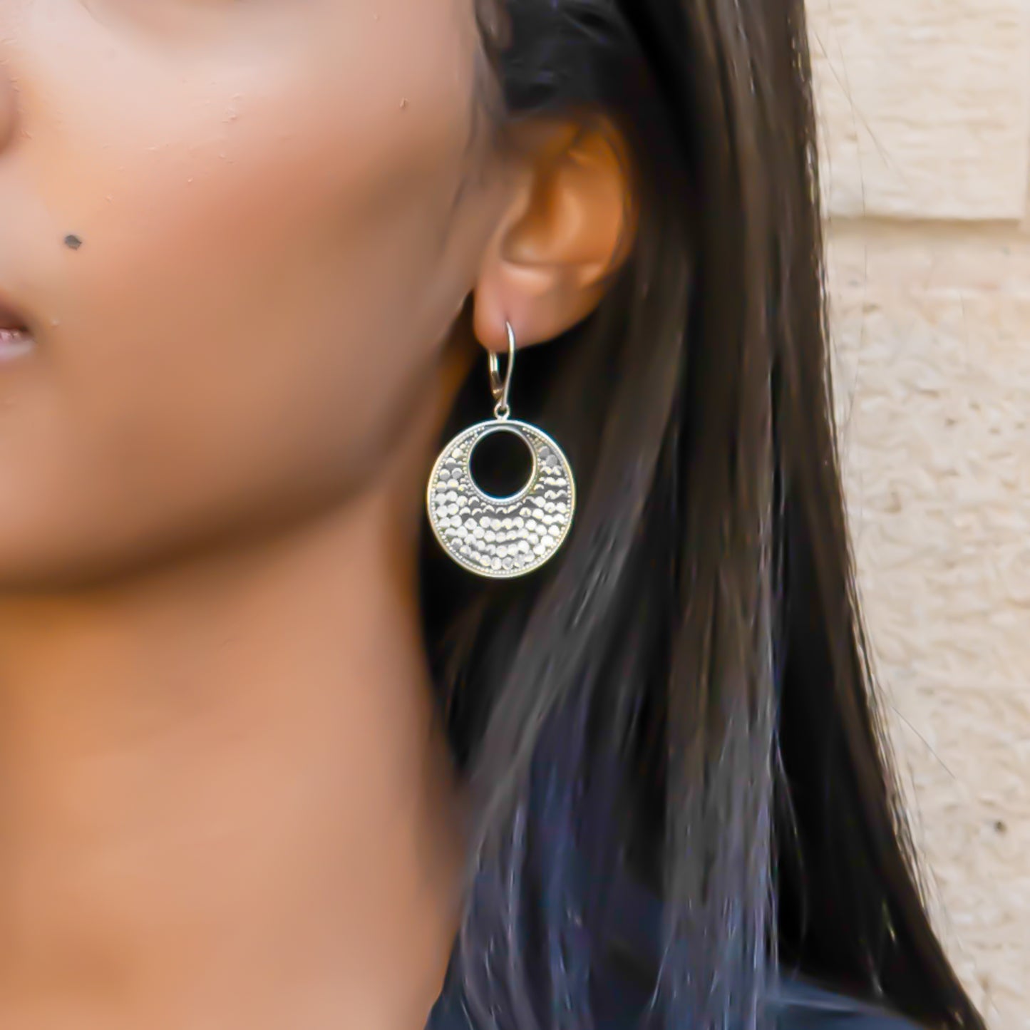 Sterling silver dotted disc earrings.