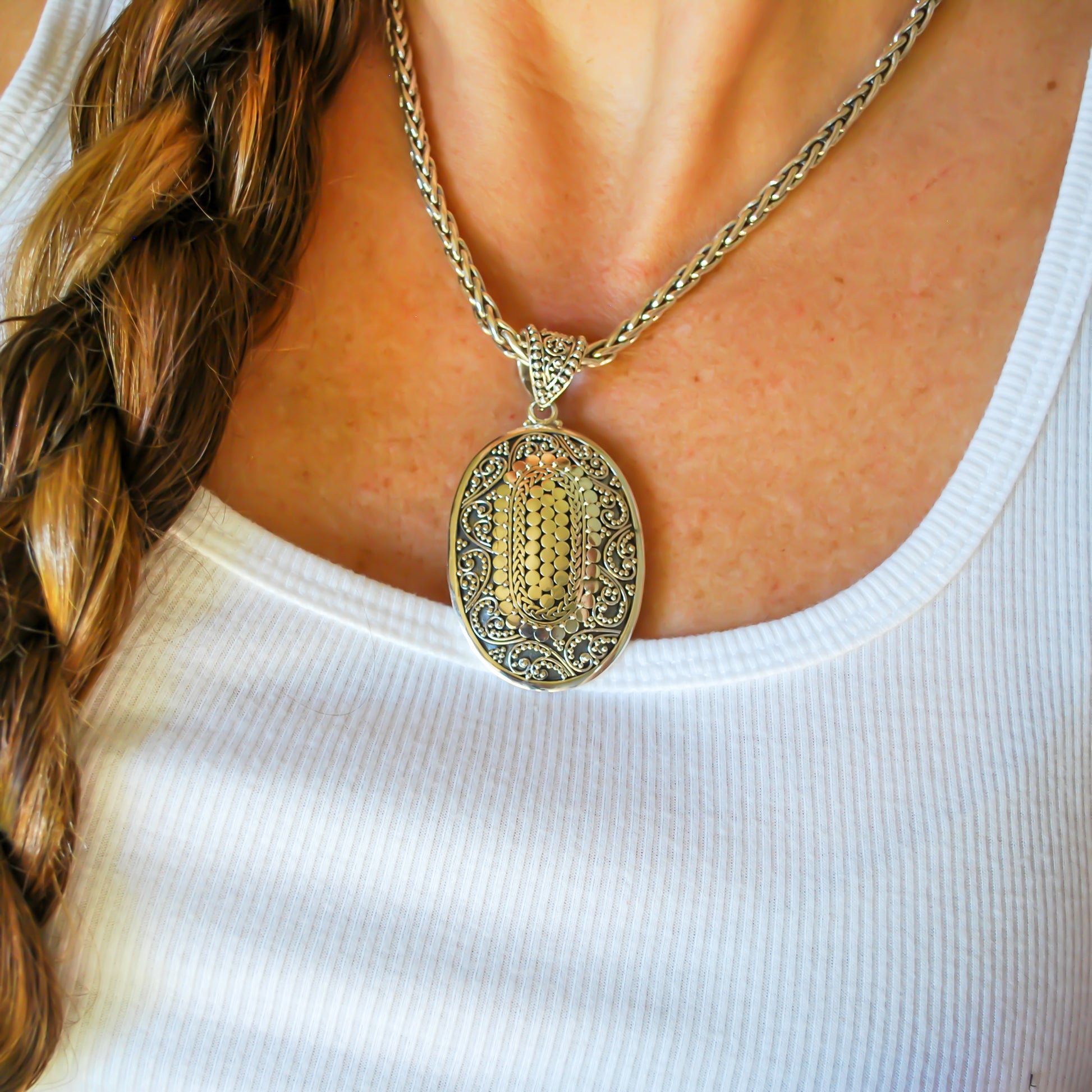 Sterling silver ornate oval large pendant.