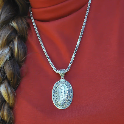 Sterling silver ornate oval large pendant.