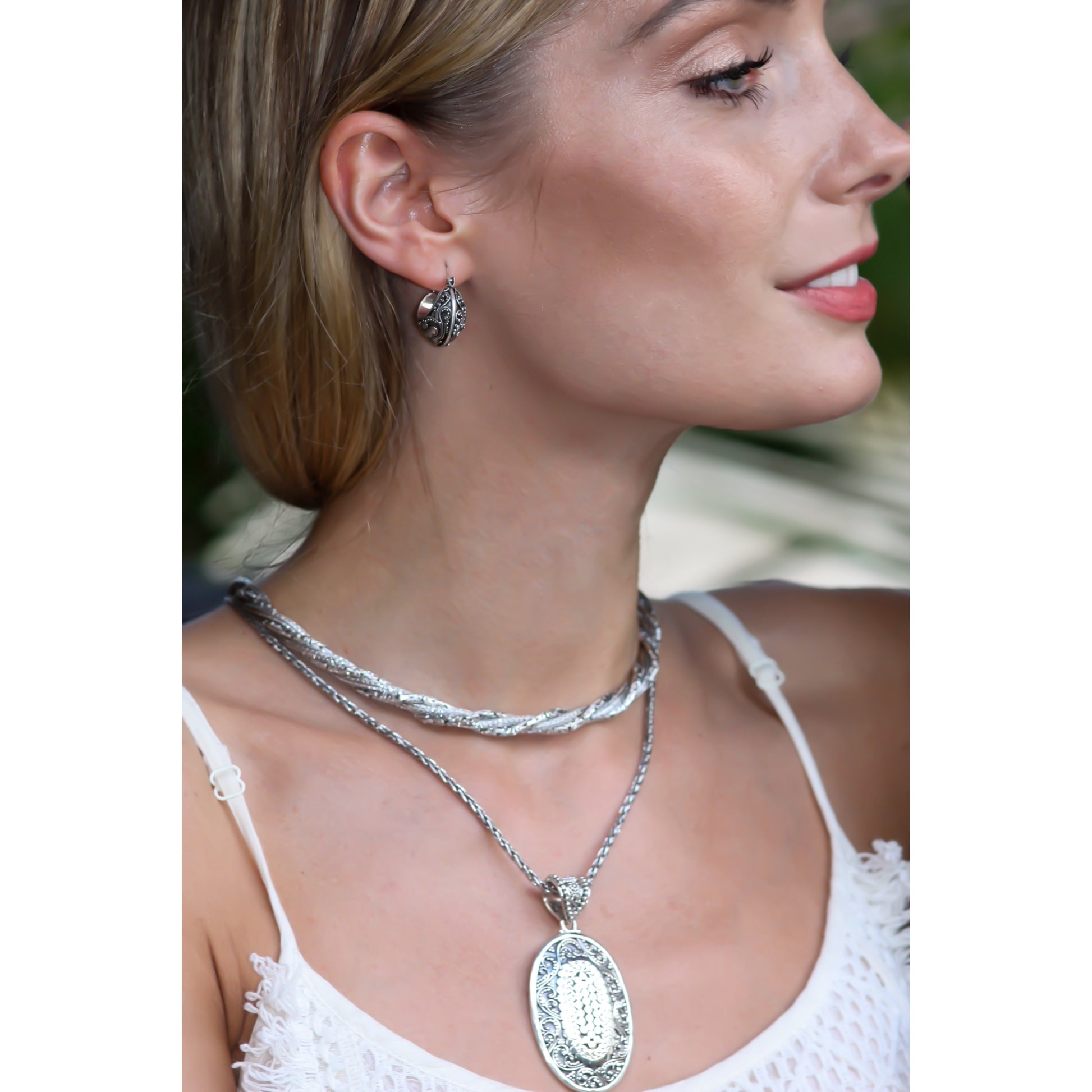 Three chain Sterling silver necklace. Twisted motif. 