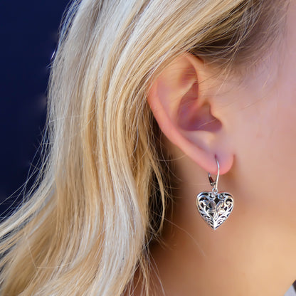 Sterling silver heart floral earrings.