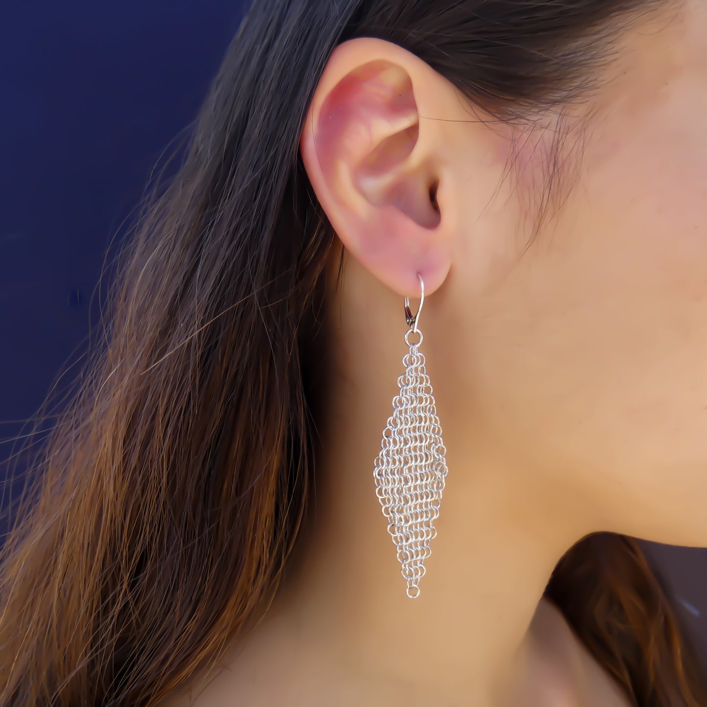 Sterling silver mesh dangle earrings.