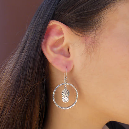 Sterling silver ring and disc drop earrings.