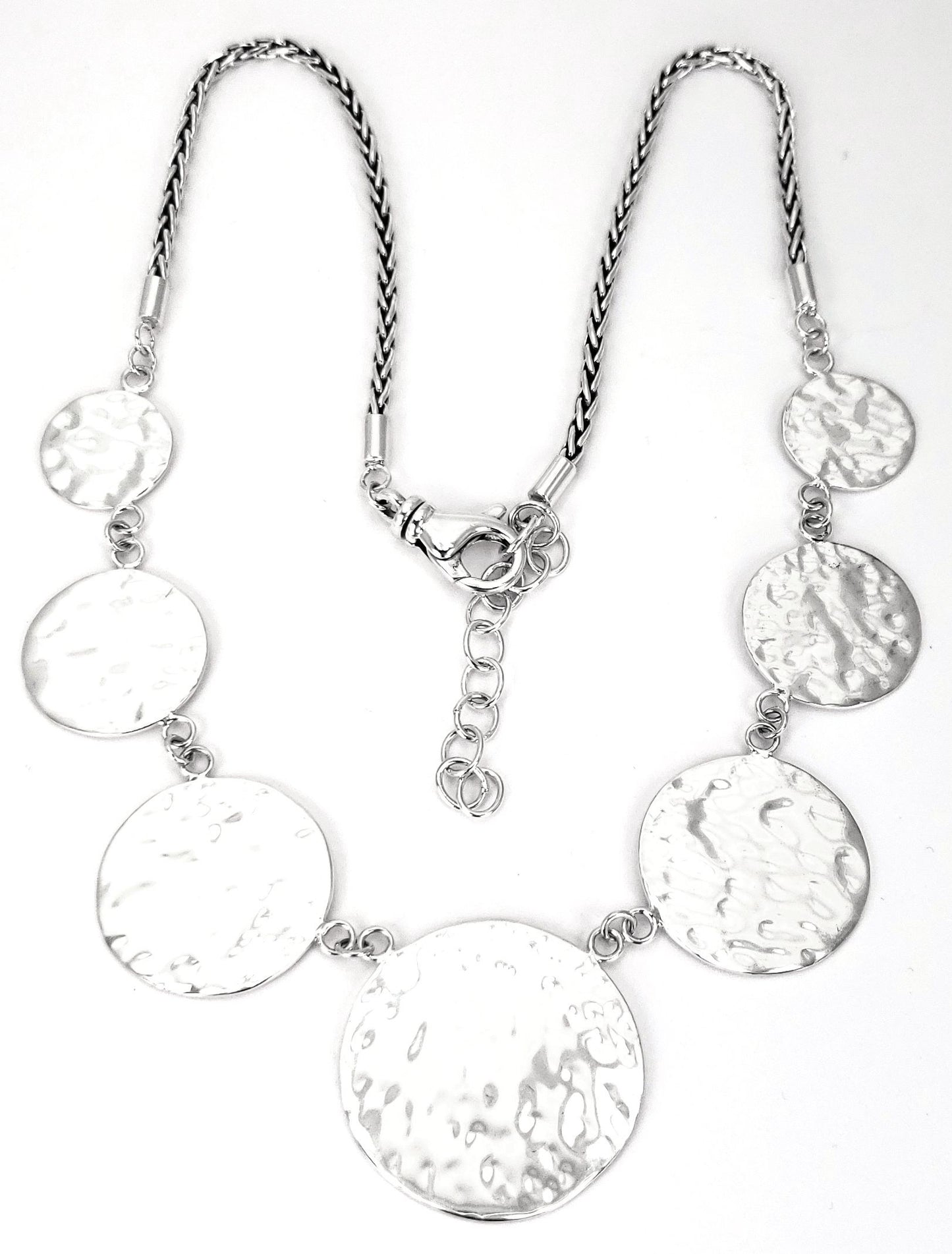 Sterling silver hammered disc necklace.