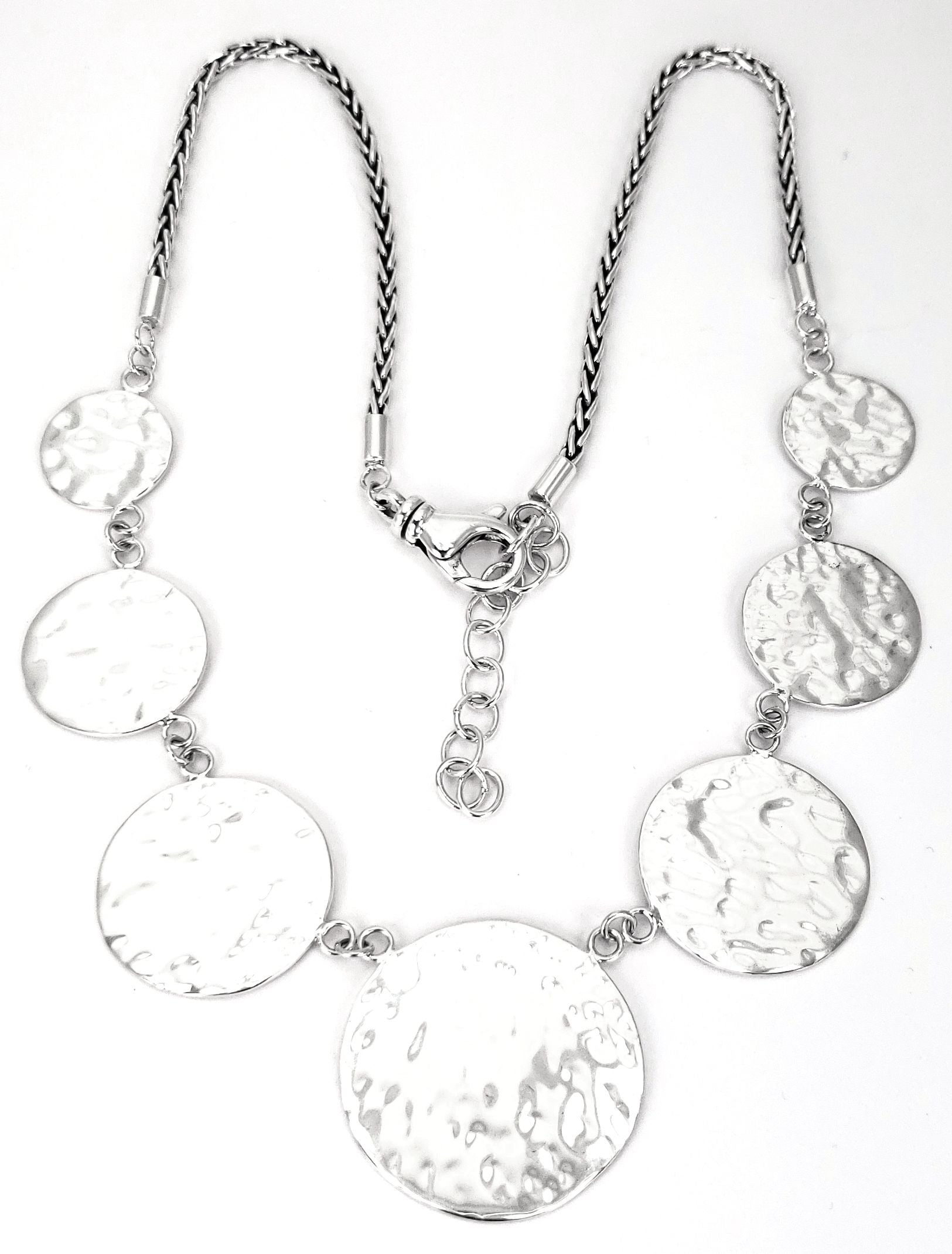 Sterling silver hammered disc necklace.