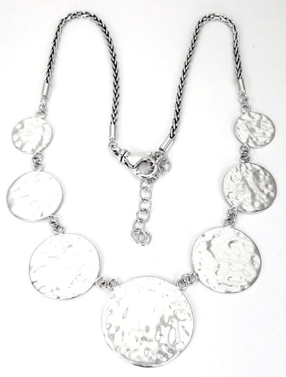 Sterling silver hammered disc necklace.