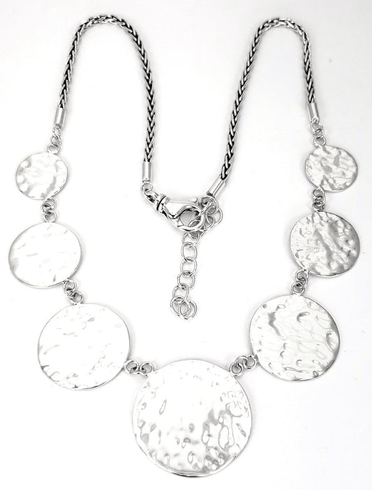 Sterling silver hammered disc necklace.