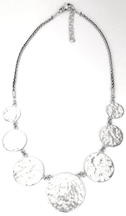 Sterling silver hammered disc necklace.