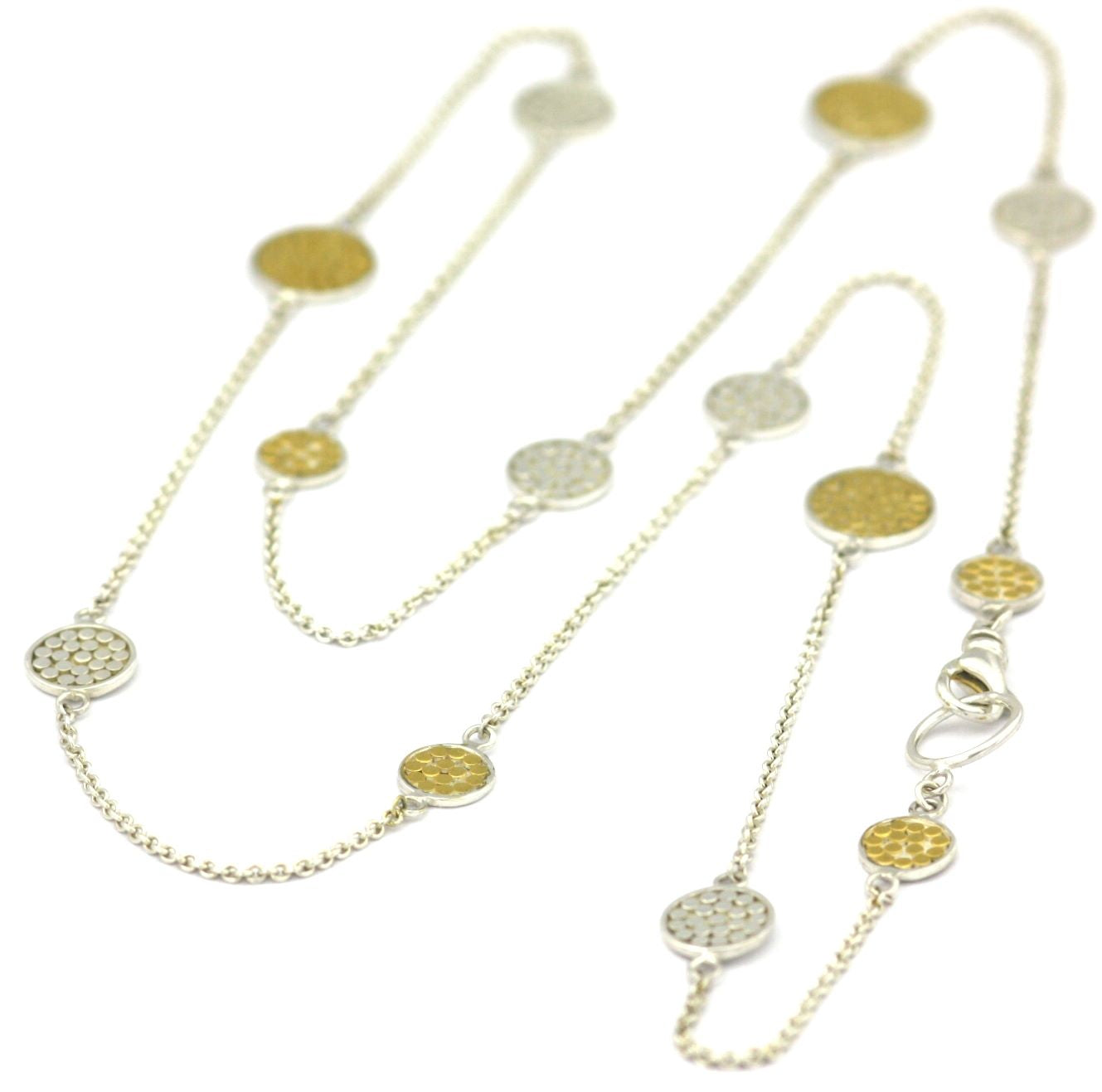 Sterling silver and gold necklace with lightweight chain and dotted discs.