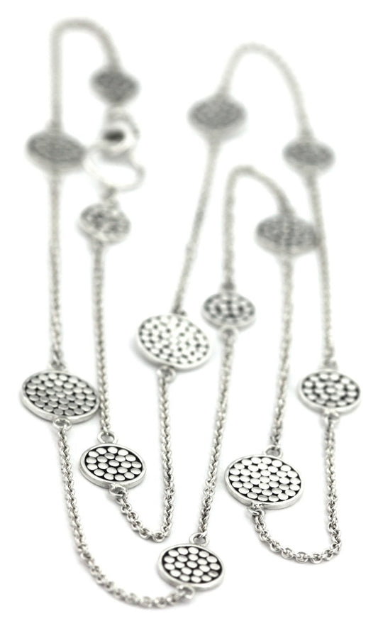 Sterling silver necklace with lightweight chain and dotted discs.