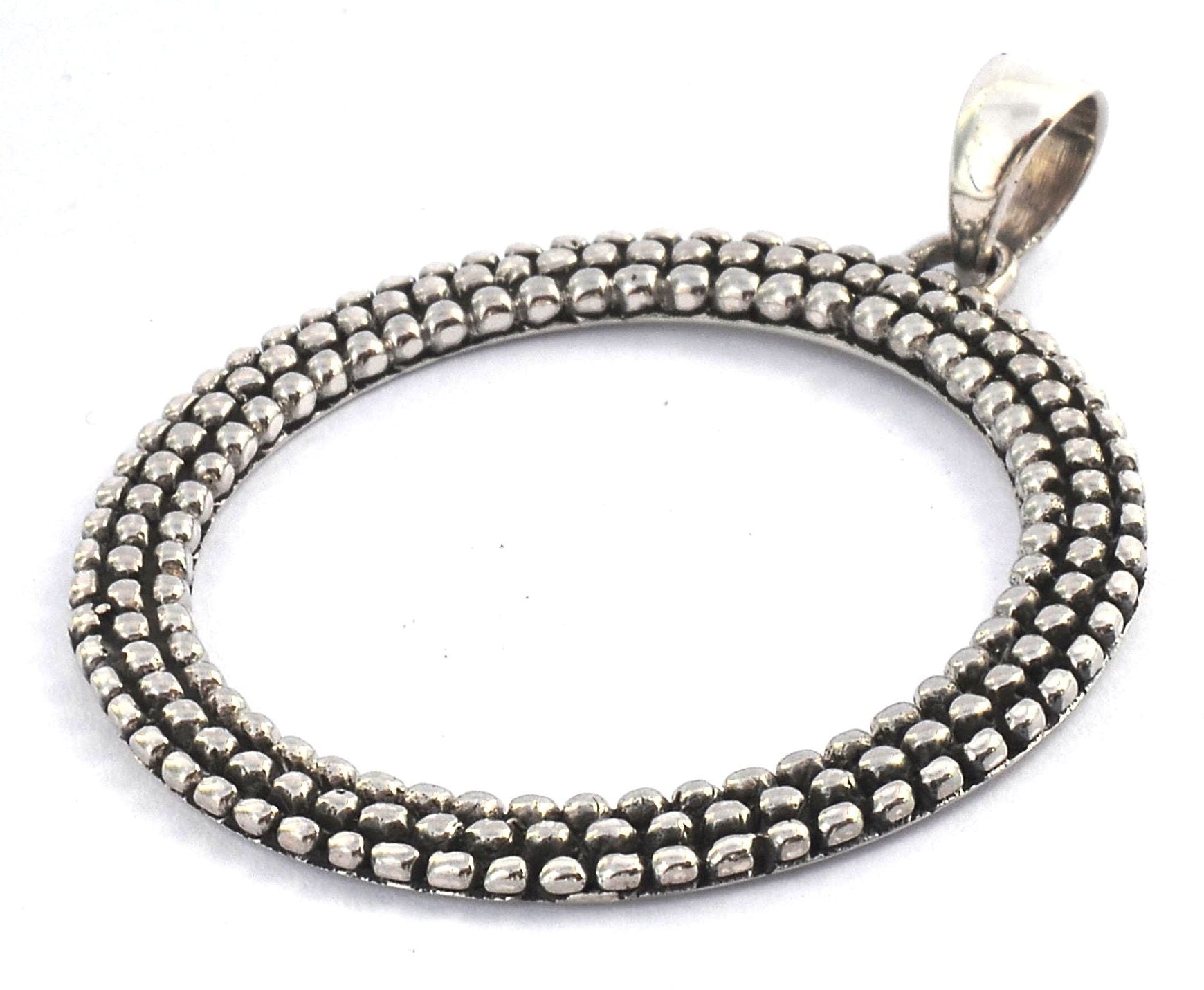 Sterling silver circle pendant.