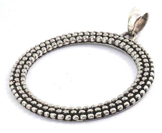 Sterling silver circle pendant.